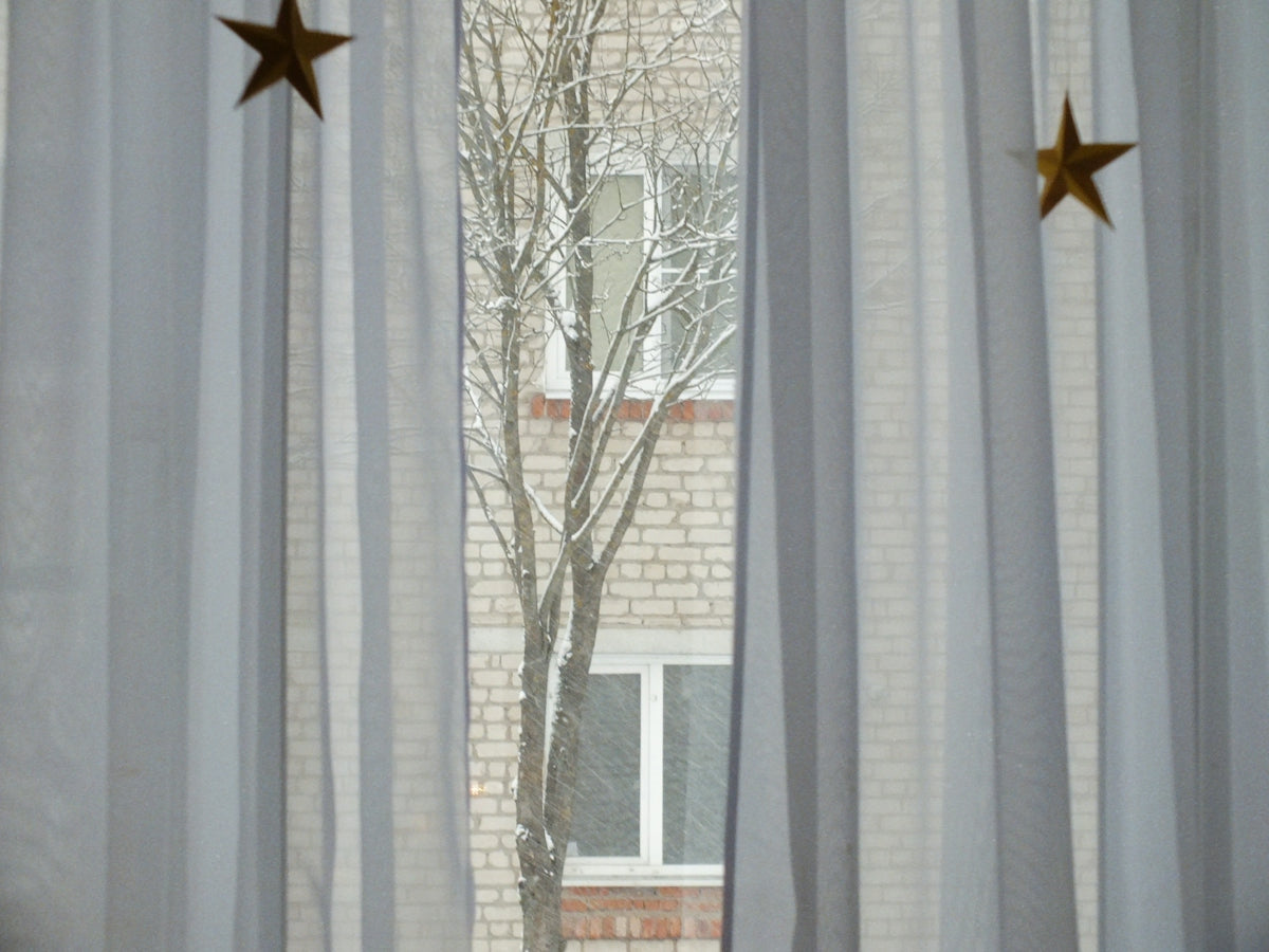 white and gray floral window curtain